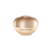 A jar of Chogongjin Geumsul Jin Eye Cream with a gold-colored label and a glossy, metallic gold finish.